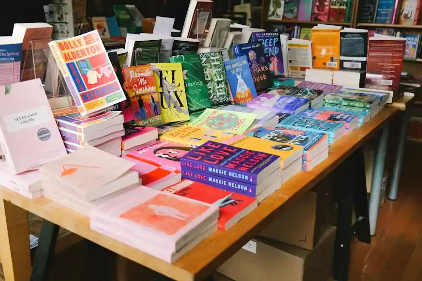 Books neatly arranged on a table in a bookstore